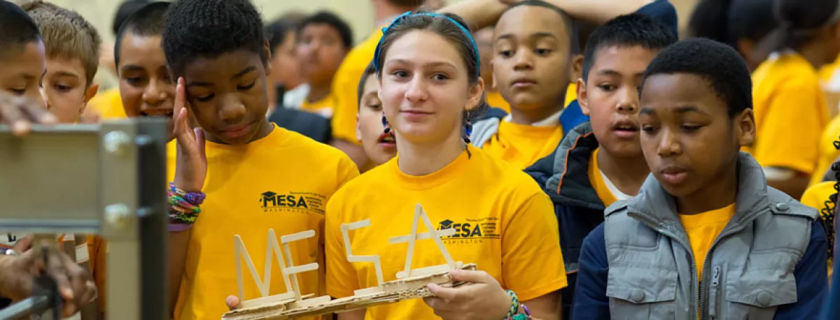 Several young students gather during participation in MESA.