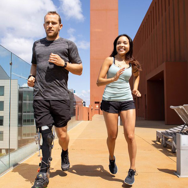 Two UCSF community members jog through Mission Bay Campus.